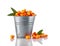 Bucket of healthy fresh raw sea buckthorn berries