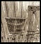 Bucket on ladder  metal on metal wooden back ground