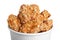 Bucket with yummy fried nuggets on background, closeup