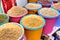 Buckets with various dried seeds on the food market, Iran.