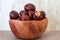 Buckeye Chestnut in wooden bowl on burlop surface. Side View formation of Fresh conkers