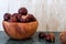 Buckeye Chestnut in wooden bowl on marble surface. Side View formation of Fresh conkers