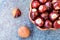 Buckeye Chestnut in wooden bowl on marble surface. Top View formation of Fresh conkers