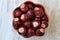 Buckeye Chestnut in wooden bowl on marble surface. Top View formation of Fresh conkers