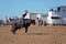 Bucking Bull Riding At A Country Rodeo