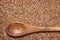 Buckwheat background with brown wooden spoon