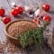 Buckwheat in a bowl with tomato, garlic and thyme