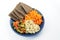 Buckwheat, flax breads, pepper and carrot on the plate