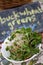 Buckwheat Greens in White Bowl with Chalk Sign