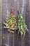 Buckwheat and medical mugwort Artemisia vulgaris bunch on old wall
