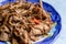 Buckwheat noodle with chiken and mushrooms. Closeup view