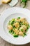 Buckwheat nudi with green peas and parmesan