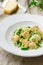 Buckwheat nudi with green peas and parmesan