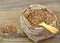 Buckwheat in paper bag on wood background