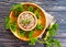 Buckwheat porridge, cereal prepared recipe rustic parsley on a wooden background vegan