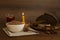 Buckwheat porridge, spoon, rosary beads, bread and candle on wooden table. Lent season