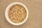 Buckwheat sprouts. White plate. Neutral background