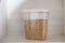Buckwheat in a transparent container to store cereals on wooden background