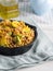Buckwheat with zucchini and turmeric in skillet