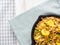 Buckwheat with zucchini and turmeric in skillet