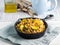 Buckwheat with zucchini and turmeric in skillet