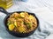 Buckwheat with zucchini and turmeric in skillet