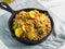 Buckwheat with zucchini and turmeric in skillet