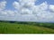 Bucolic cloudscape on the road between Curitiba and Londrina, with fields, cows, cultivations, ParanÃ  State,summer 2018e