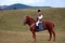 Bucovinian boy on horse in Bucovina in traditional clothes