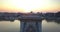 Budapest, Hungary - 4K drone flying up at famous Szechenyi Chain Bridge at sunrise