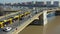 Budapest, Hungary - 4K drone following a yellow tram on Margaret Bridge