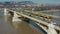 Budapest, Hungary - 4K drone following a yellow tram on Margaret Bridge