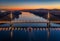 Budapest, Hungary - Aerial drone view of the beautiful illuminated cable-stayed Megyeri Bridge over River Danube at sunset