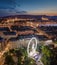 Budapest, Hungary - Aerial panoramic skyline view of Budapest at blue hour with illuminated ferris wheel at Elisabeth Square