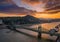 Budapest, Hungary - Aerial skyline view of a beautiful sunset over River Danube and Gellert Hill with sightseeing boat