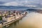 Budapest, Hungary - Aerial view of the beautiful Parliament of Hungary at sunset with golden lights and sightseeing boats