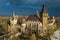 Budapest, Hungary - Aerial view of beautiful Vajdahunyad Castle in City Park at sunset with dark clouds behind