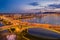 Budapest, Hungary - Aerial view of blue hour at Margaret Bridge by the entrance to Margaret Island with Parliament of Hungary