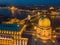 Budapest, Hungary - Aerial view of the dome of Buda Castle Royal Palace at dusk and the skyline of Budapest