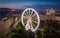 Budapest, Hungary - Aerial view of Elisabeth square at dusk with illuminated ferris wheel, St. Stephen`s Basilica and Parliament