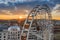 Budapest, Hungary - Aerial view of the famous ferris wheel of Budapest with Buda Castle Royal Palace and an amazing golden sunset