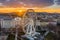 Budapest, Hungary - Aerial view of the famous ferris wheel of Budapest with Buda Castle Royal Palace and an amazing sunset