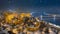 Budapest, Hungary - Aerial view of illuminated Buda Castle Royal Palace on a winter night with heavy snowing