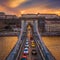 Budapest, Hungary - Aerial view of Szechenyi Chain Bridge with afternoon traffic, beautiful golden sunset sky