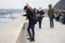 Budapest, Hungary - April 10, 2018: Young women concentrated looks at the mobile phone screen