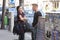 Budapest, Hungary - April 9, 2018: Cheerful guy and girl talking on street