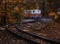 Budapest, Hungary - Beautiful autumn scenery with the Children`s train on the S curve track in the Hungarian woods of Huvosvolgy