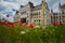 Budapest, Hungary: Beautiful flowering red poppies and flowers on green grass near the Parliament building in Budapest