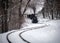 Budapest, Hungary - Beautiful winter forest scene with snow and old steam locomotive on the track in the Hungarian woods