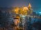 Budapest, Hungary - Christmas market in snowy City Park Varosliget from above at night with snowy trees and Vajdahunyad castle